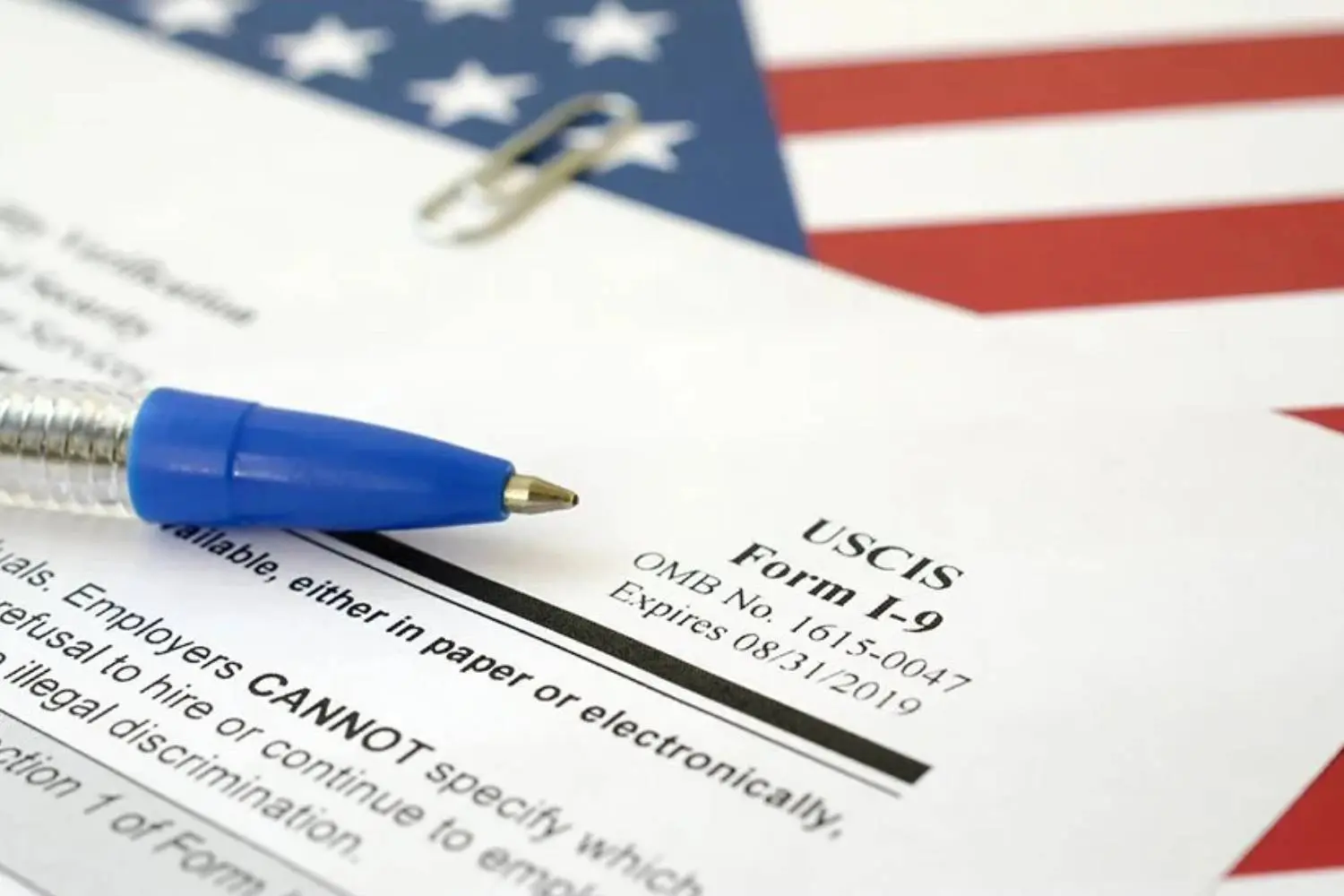New Project - 2025-04-22T123051.992 A pen and paper on top of an american flag.